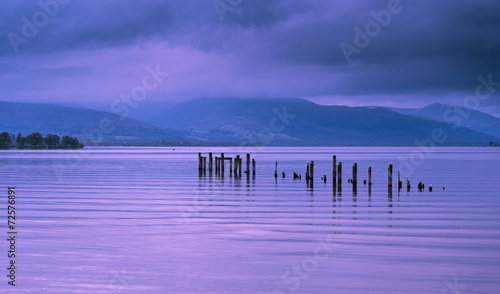 Loch Lomond jetty and mountains at sunset photo