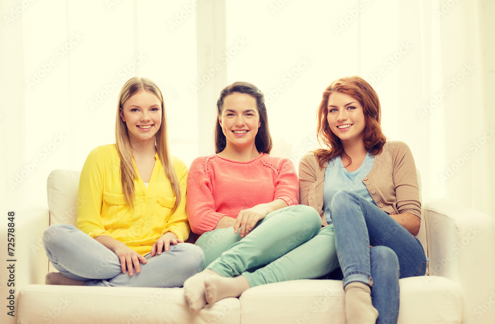 three girlfriends having a talk at home three girlfriends having a talk at home