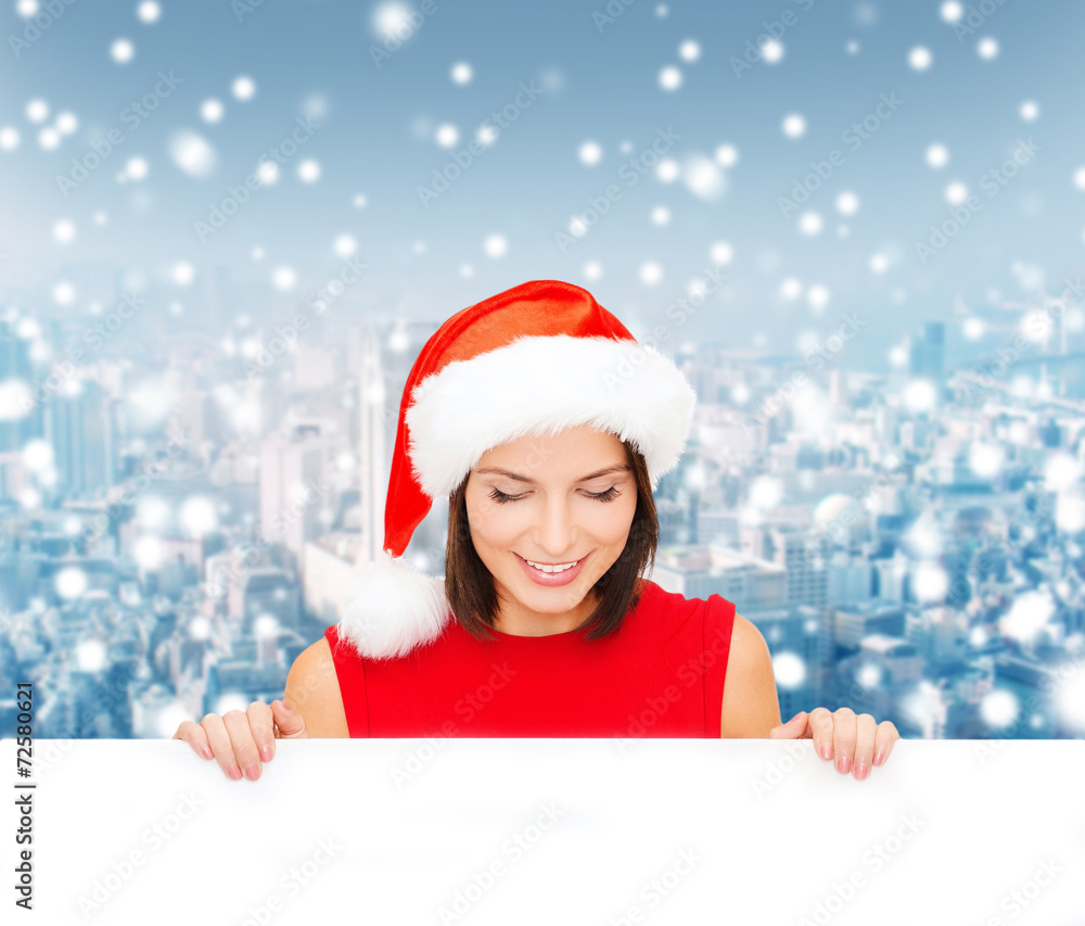 woman in santa helper hat with blank white board woman in santa helper hat with blank white board