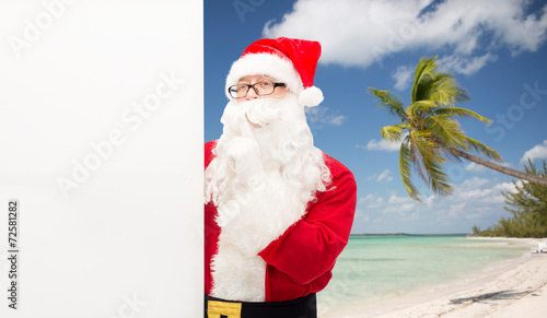 man in costume of santa claus with billboard