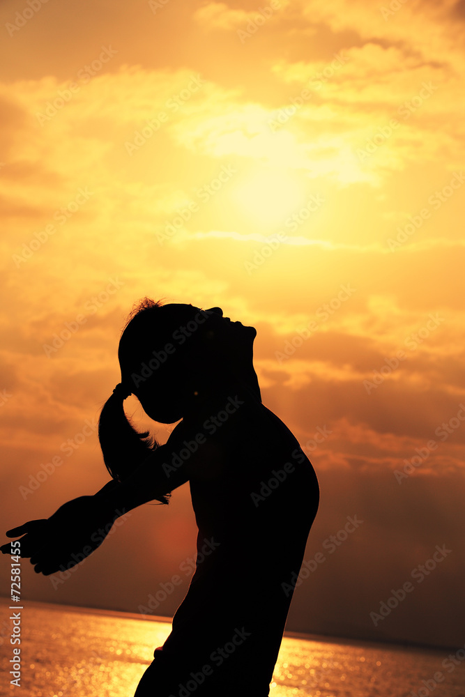 cheering woman open arms under the sunrise at seaside cheering woman open arms under the sunrise at seaside