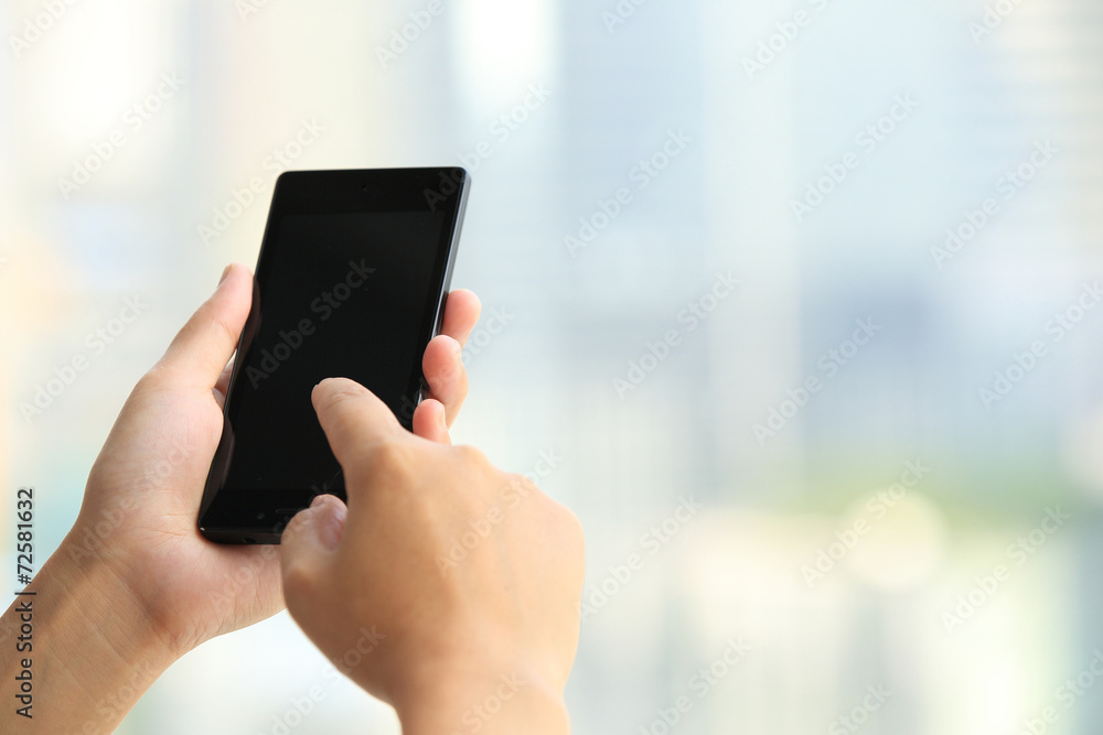 young woman hands use cellphone in city 