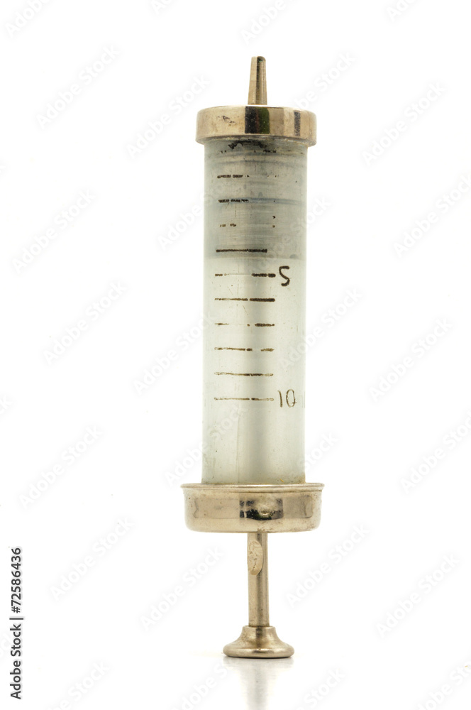 Naklejka premium Vintage glass and metal syringes on white background