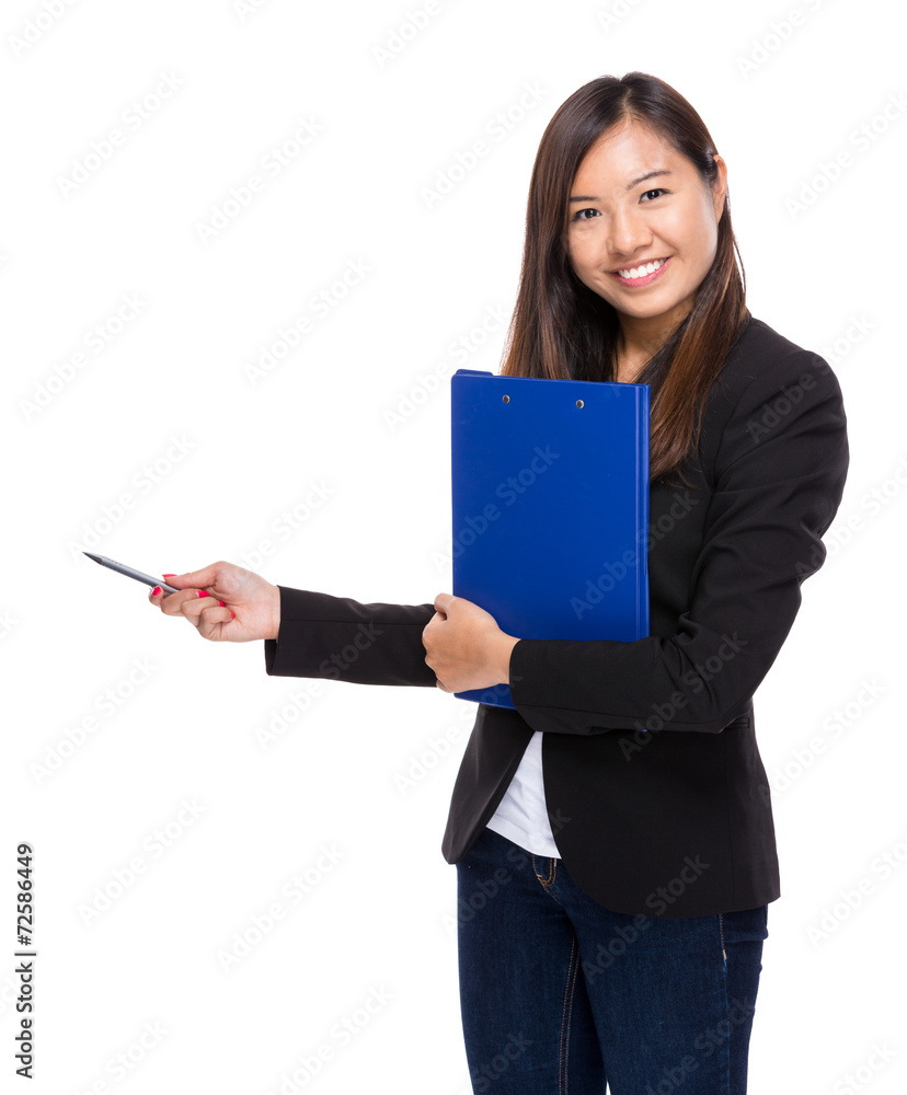 Businesswoman with clipboard and pen point aside Businesswoman with clipboard and pen point aside