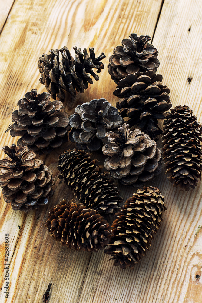 pine cones on wooden background pine cones on wooden background