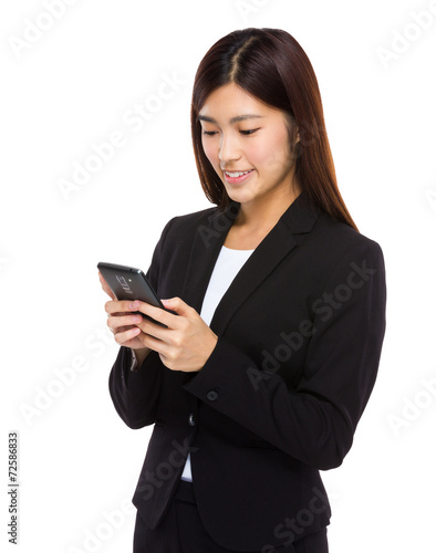 Businesswoman look at mobile phone