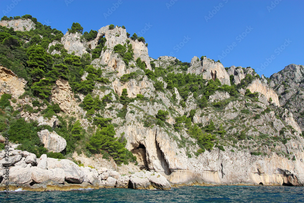 An arch and caves on the coast of Capri island, Italy An arch and caves on the coast of Capri island, Italy