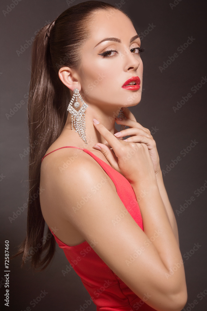 Fashion Woman Portrait in evening dress and with jewelery