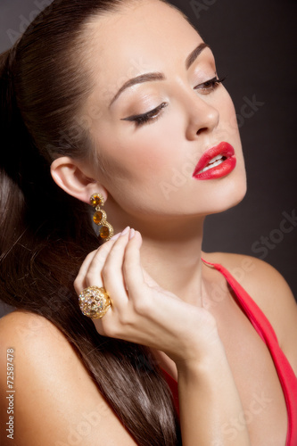 Fashion Woman Portrait in evening dress and with jewelery