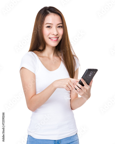 Woman send message on mobile phone