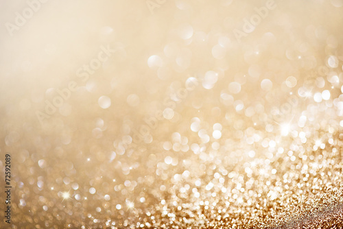 Christmas gold background. Golden holiday glowing background