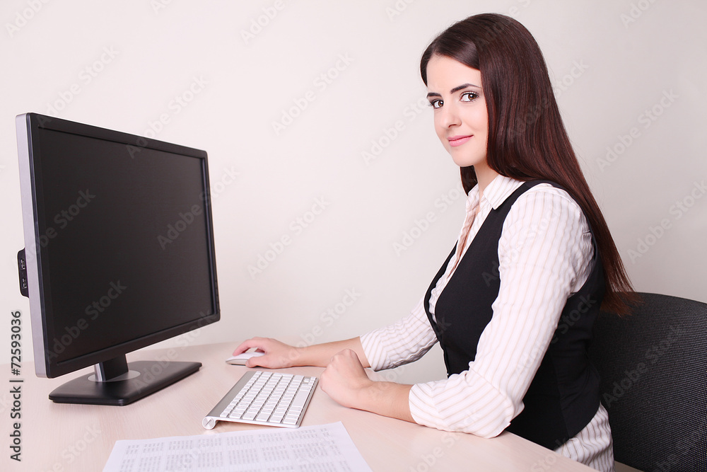 Beautiful mature businesswoman using computer in office Beautiful mature businesswoman using computer in office