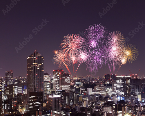 Fireworks celebrating over Tokyo cityscape at night © geargodz