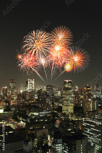 Fireworks celebrating over Tokyo cityscape at night