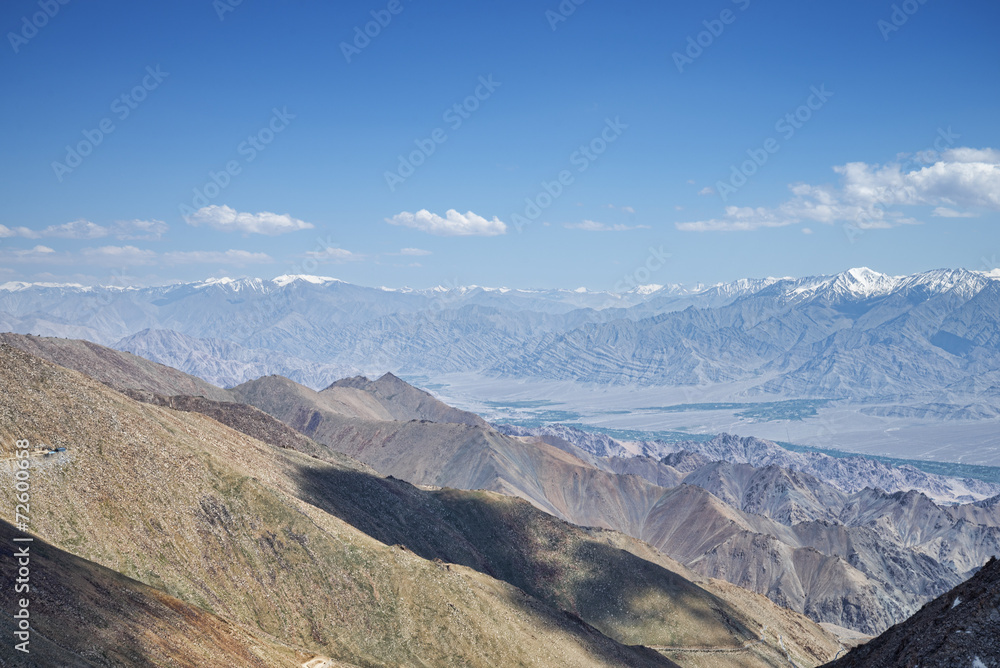 Aerial view to mountain range and valley of Leh