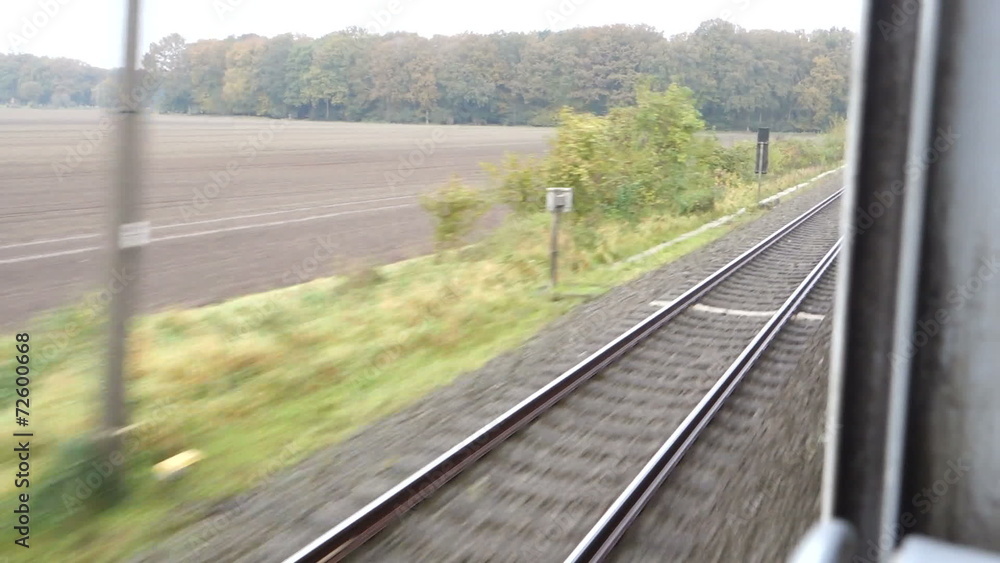 Travelling by train, looking out of the window Travelling by train, looking out of the window