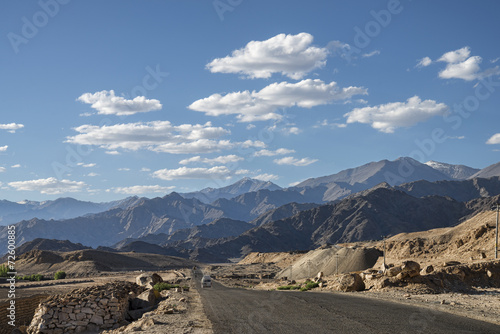 Scenic view of mountain road with majestic mountains backgound