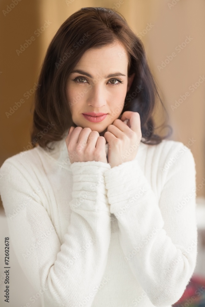 Brunette in white wool jumper posing Brunette in white wool jumper posing