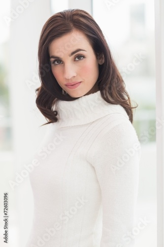 Pretty brunette in white jumper posing