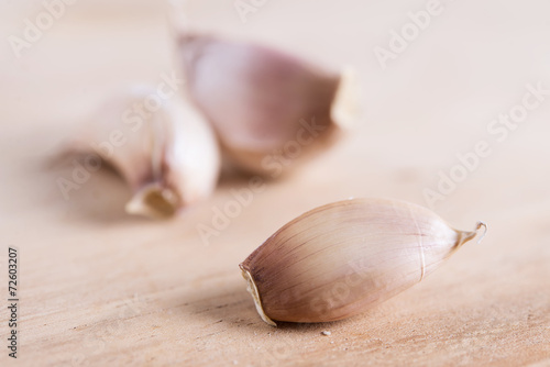 clove of garlic on wooden board