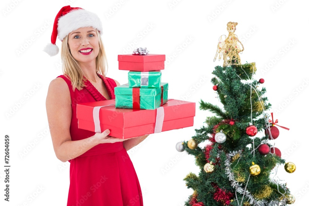 Festive blonde in red dress holding gifts Festive blonde in red dress holding gifts