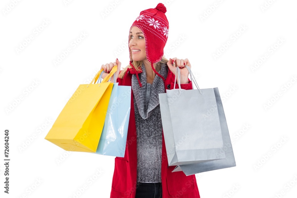Blonde in winter clothes holding shopping bags Blonde in winter clothes holding shopping bags