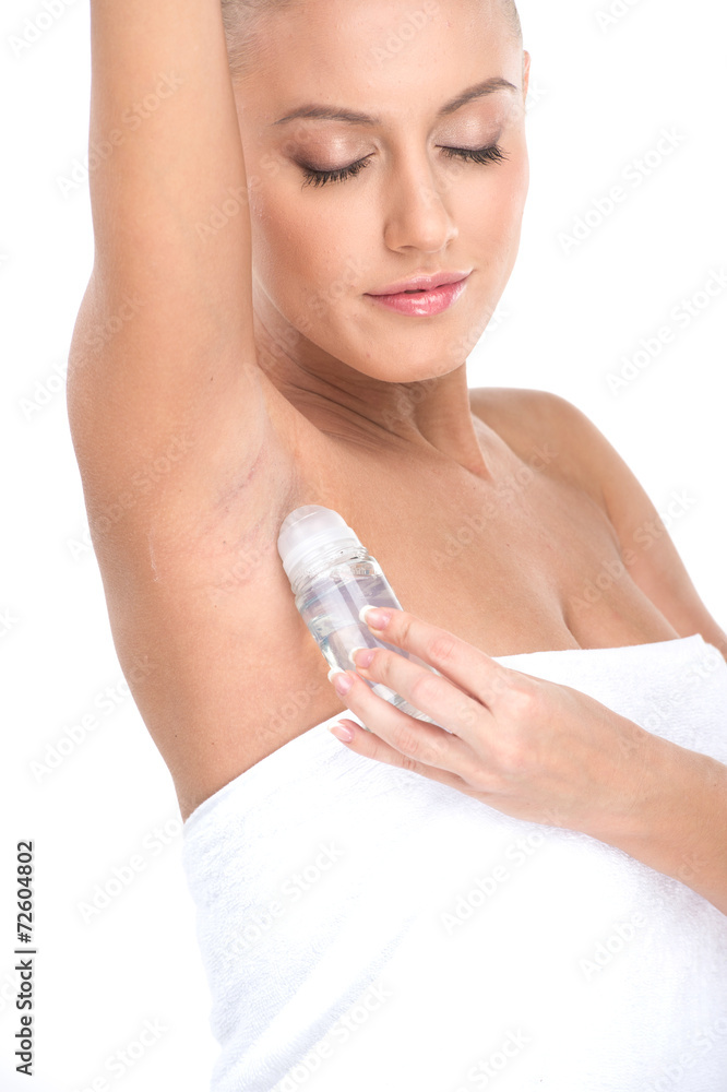 woman applying deodorant in armpit on white background. woman applying deodorant in armpit on white background.