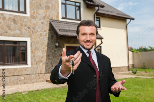 closeup on smiling real estate agent ready to sell house.