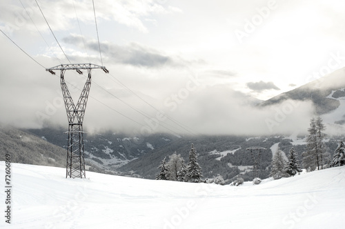 Electricity pylons in mountains © riccardomojana