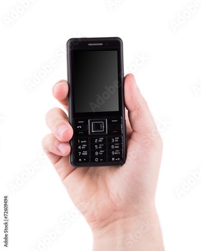 Hand holds black cell phone.