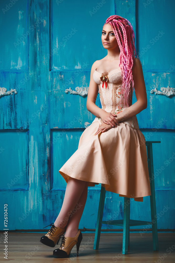 Naklejka premium Freaky young woman in vintage corset