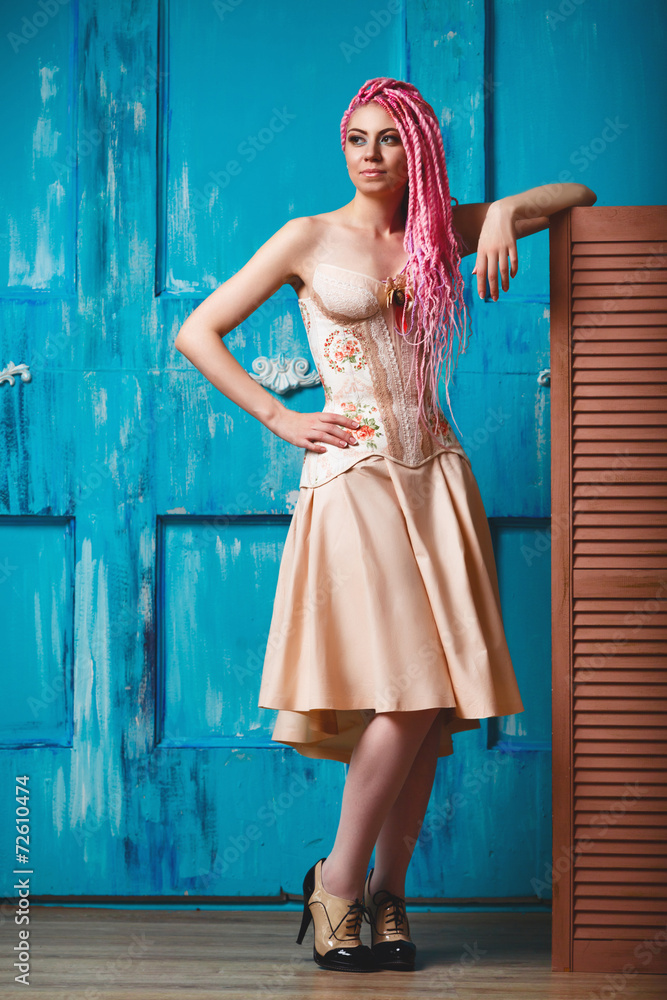 Naklejka premium Freaky young female model wearing corset