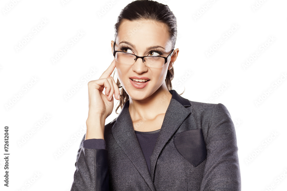 Beautiful business woman thinking about something nice Beautiful business woman thinking about something nice