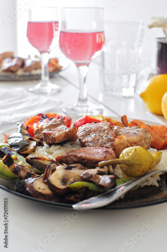 Dish with meat and vegetables served with rose wine