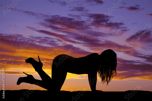 Fototapeta Naklejka Na Ścianę i Meble -  silhouette woman hands knees feet up