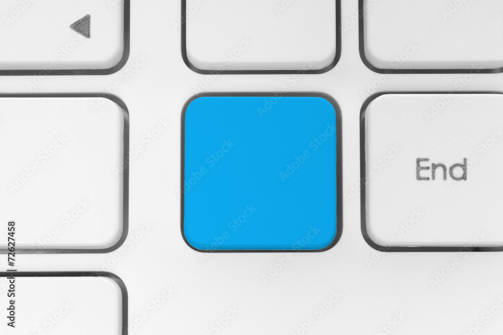 Blank blue button on the keyboard close-up. Blank blue button on the keyboard close-up.