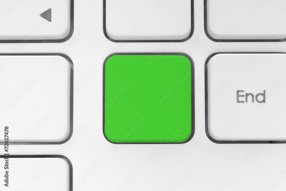 Blank green button on the keyboard close-up. Blank green button on the keyboard close-up.