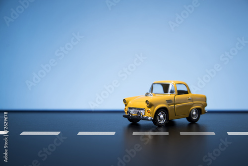 Photos Yellow fifties toy model car.