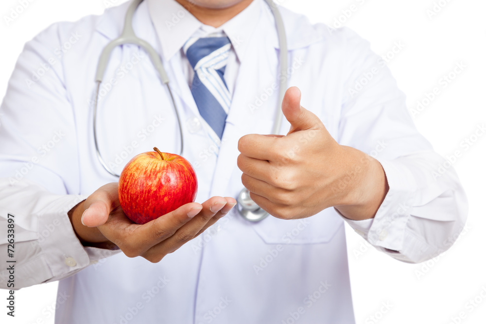 Asian male doctor thumbs up with apple Asian male doctor thumbs up with apple