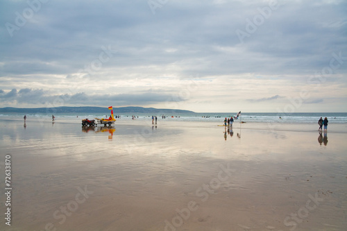 Lifeguard on Gwithian beach in Cornwall, UK.