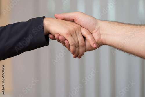 Businesswoman Extending Hand To Shake