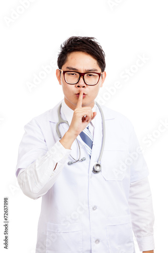 Asian male doctor do quiet sign