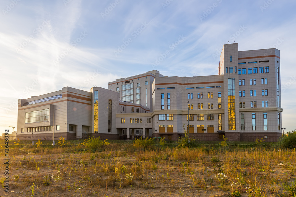 Modern office building at sunset