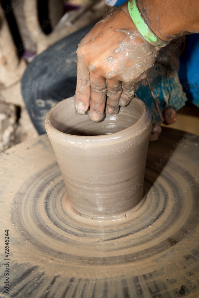close up photo of child hands in potter craft