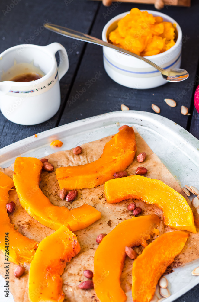 baked pumpkin slices with cinnamon and honey on parchment