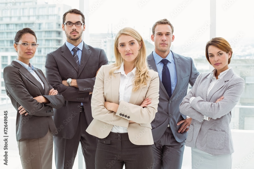 Business people with arms crossed in office Business people with arms crossed in office