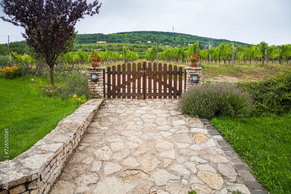 Villa garden, stone road, wooden gate