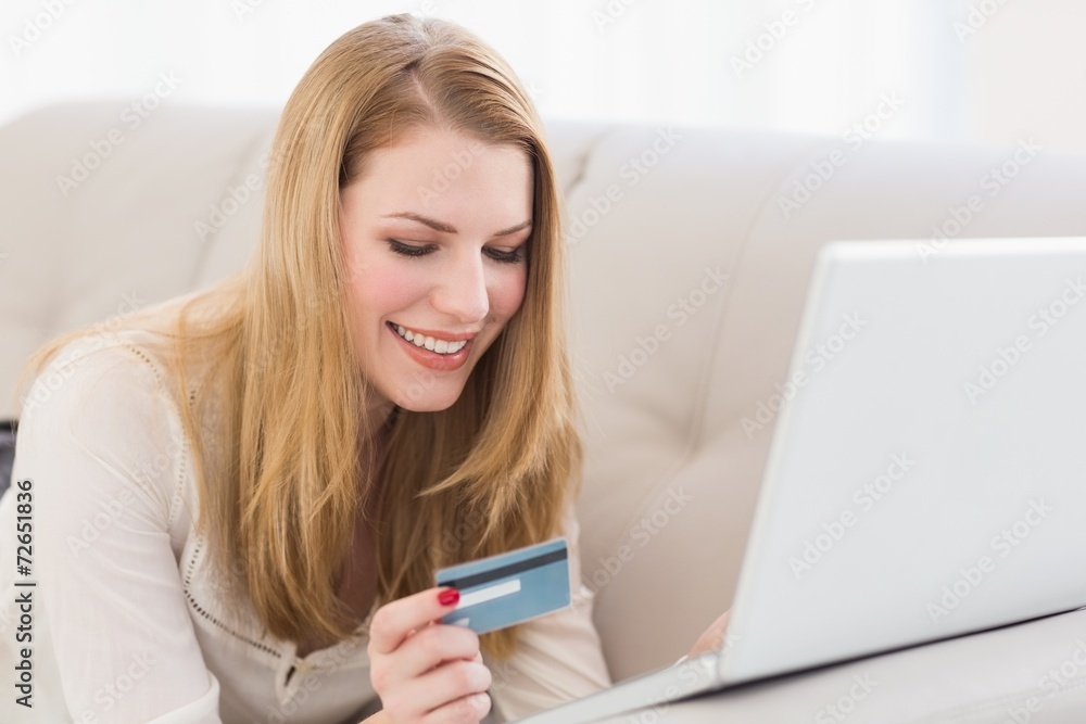 Pretty blonde shopping online with laptop Pretty blonde shopping online with laptop