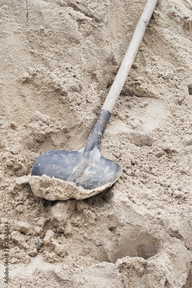 Shovel in a heap of sand Shovel in a heap of sand