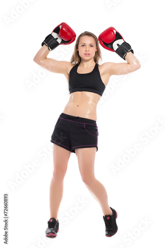 Young woman posing with boxing gloves